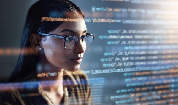 Woman looking through code
