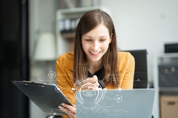 Woman working on her laptop and tablet