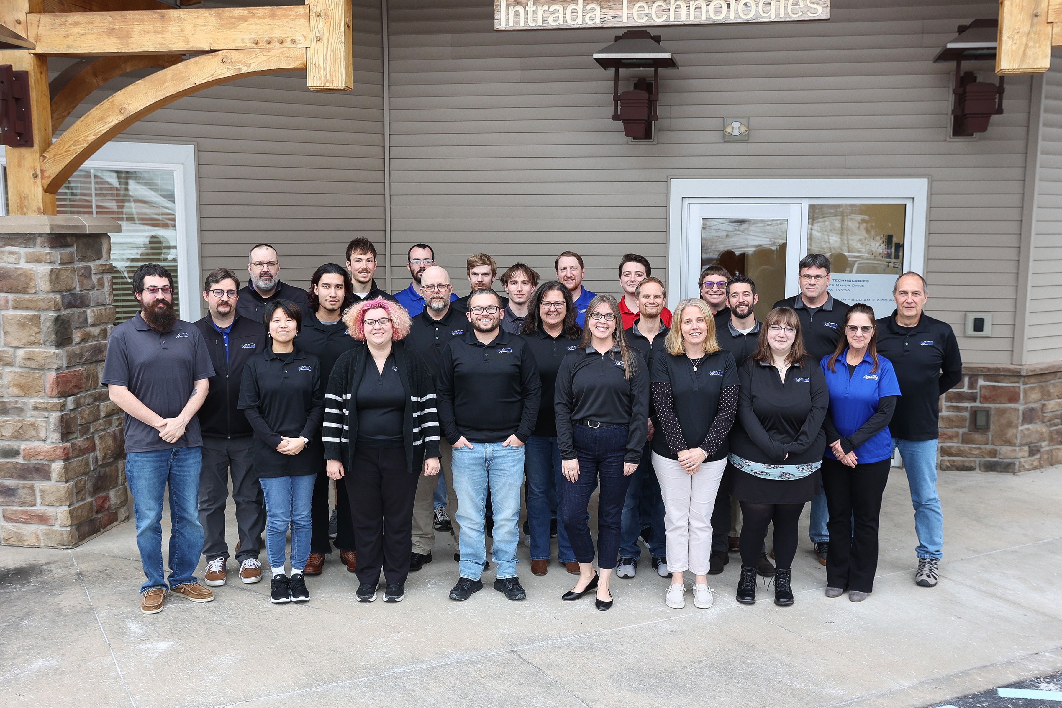 The Intrada Team, standing together in front of Intrada