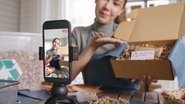 A woman filming a video to promote a product on social media