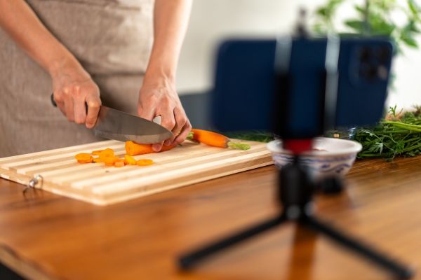 Someone recording themselves creating a dish in the kitchen