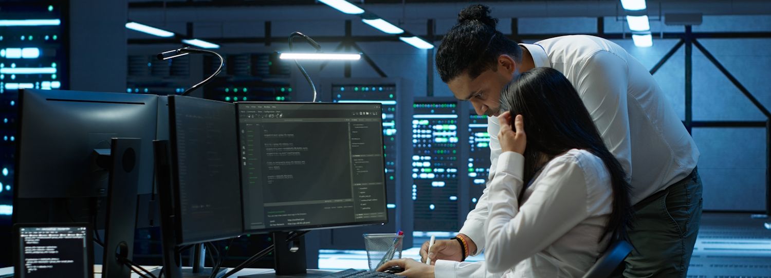 it staff working in a server room