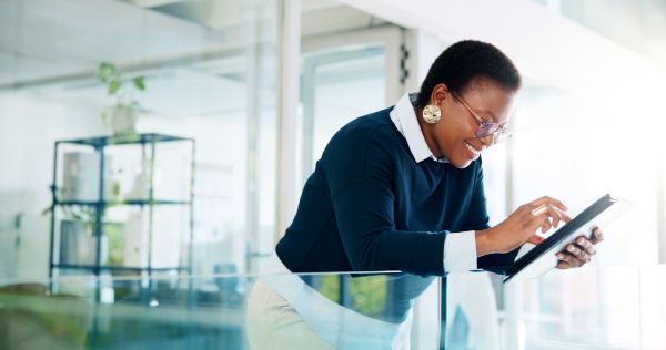 A woman checking her email on a tablet