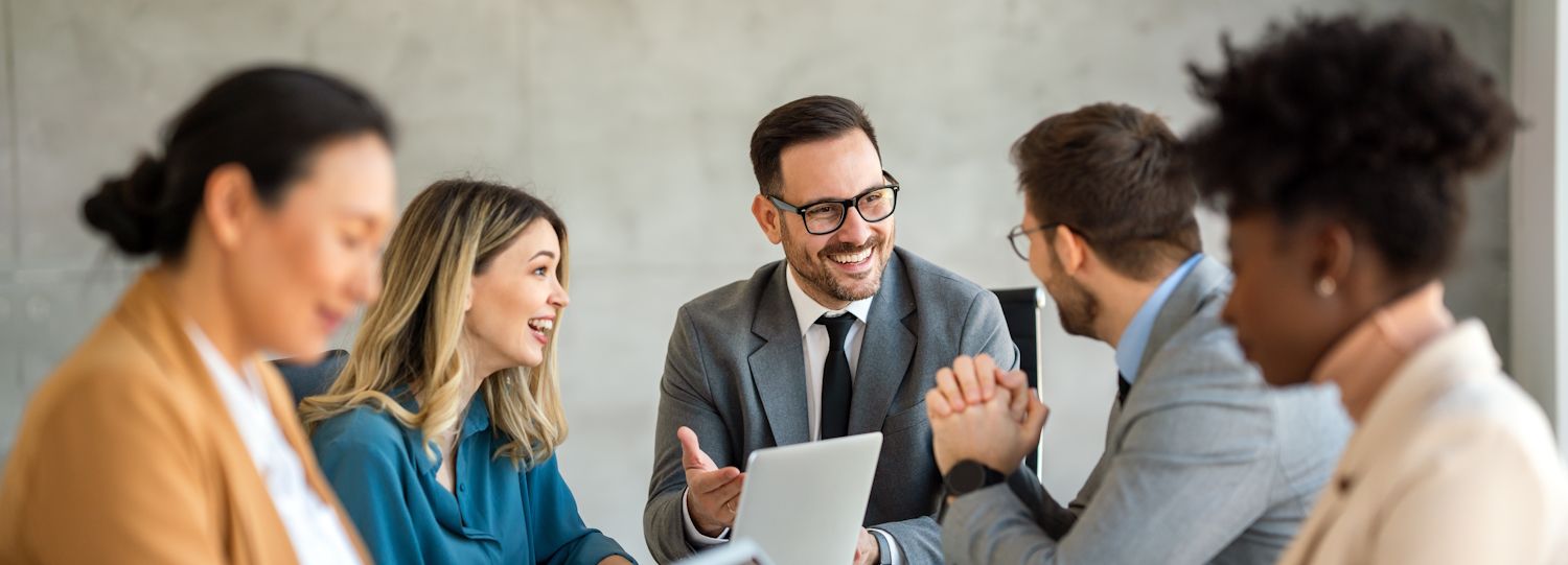 business professionals at a meeting together