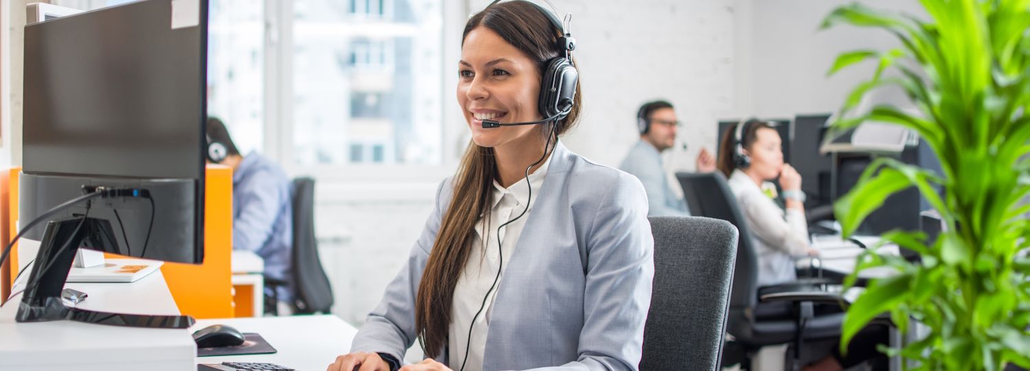 tech support agent at a workstation