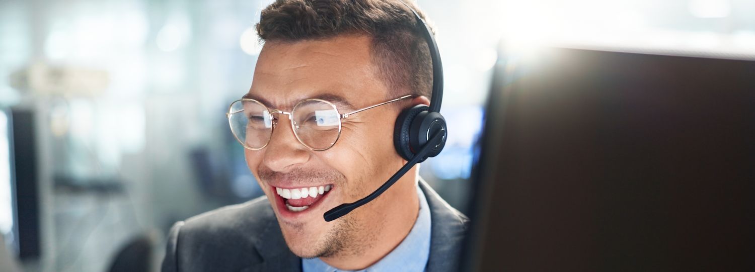 smiling support agent on a headset