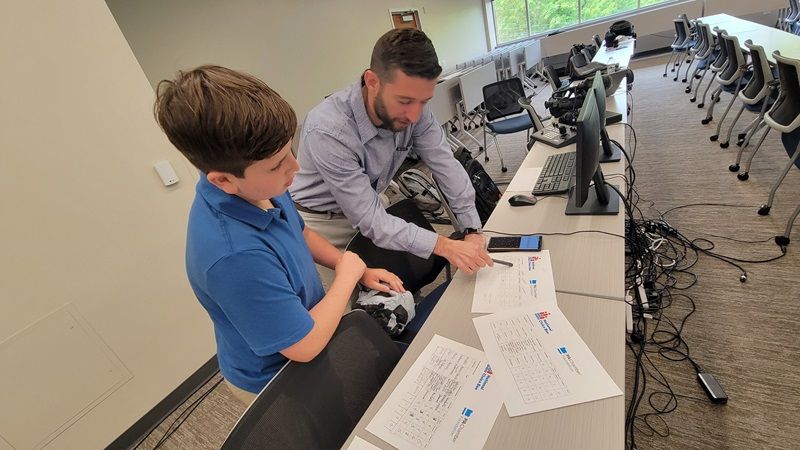 miles and james haywood looking at civics bee documents